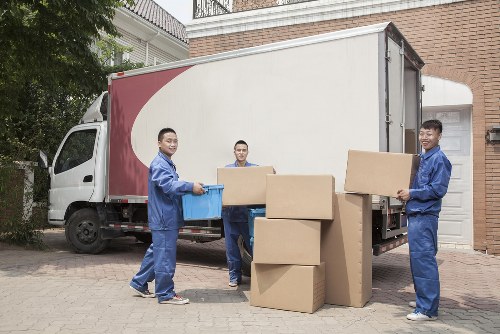Student removals team handling boxes in Belsize Park