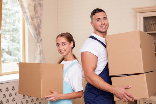 Professional movers managing stair access in a Belsize Park property